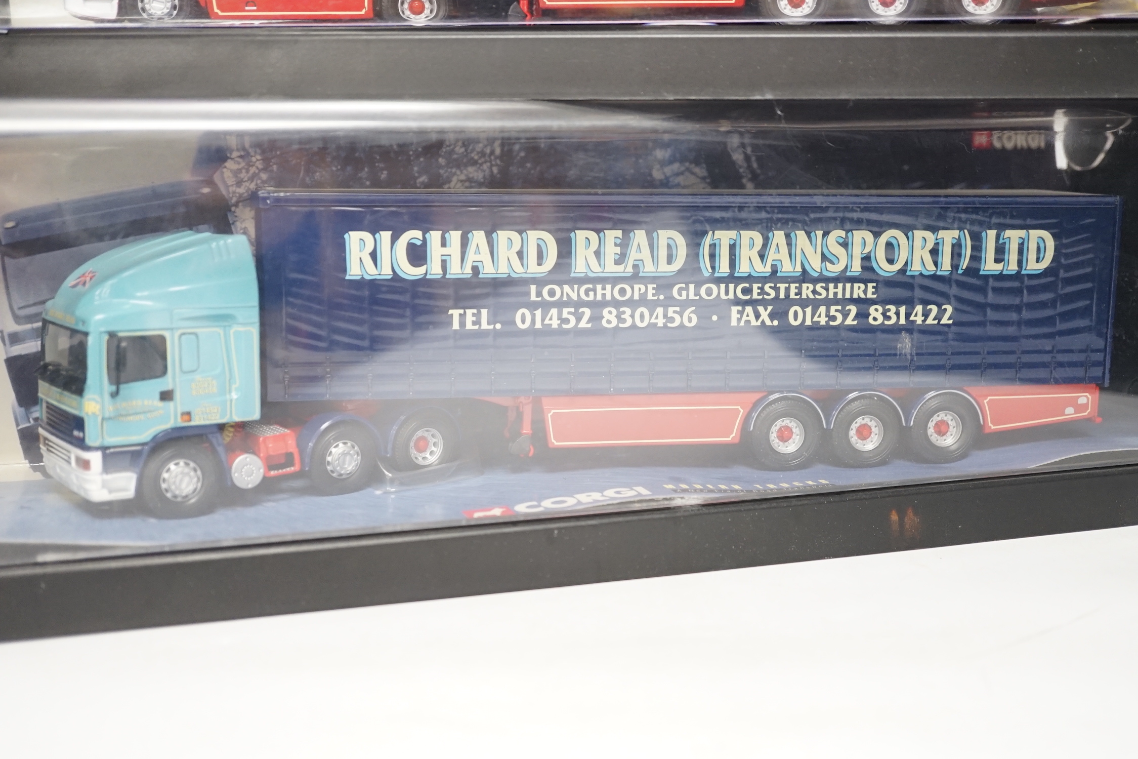 Four boxed Corgi and Universal Hobbies 1:50 scale articulated trucks; a Leyland DAF lorry (75401), an ERF curtainside lorry (75203), a Lion Toys DAF with box trailer, and a Universal Hobbies Scania Topline